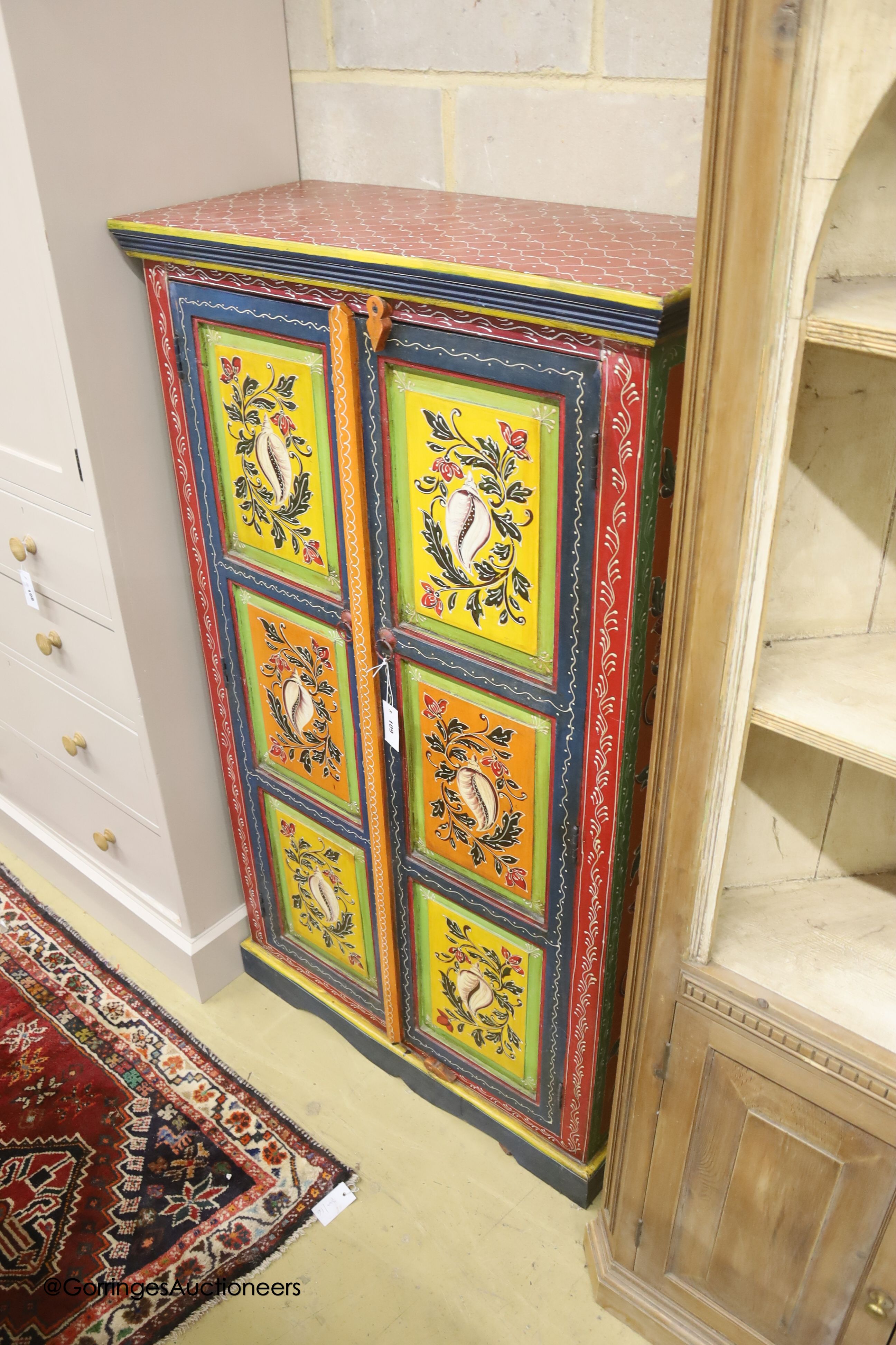 An Indian painted hardwood two door cabinet, width 85cm depth 38cm height 145cm